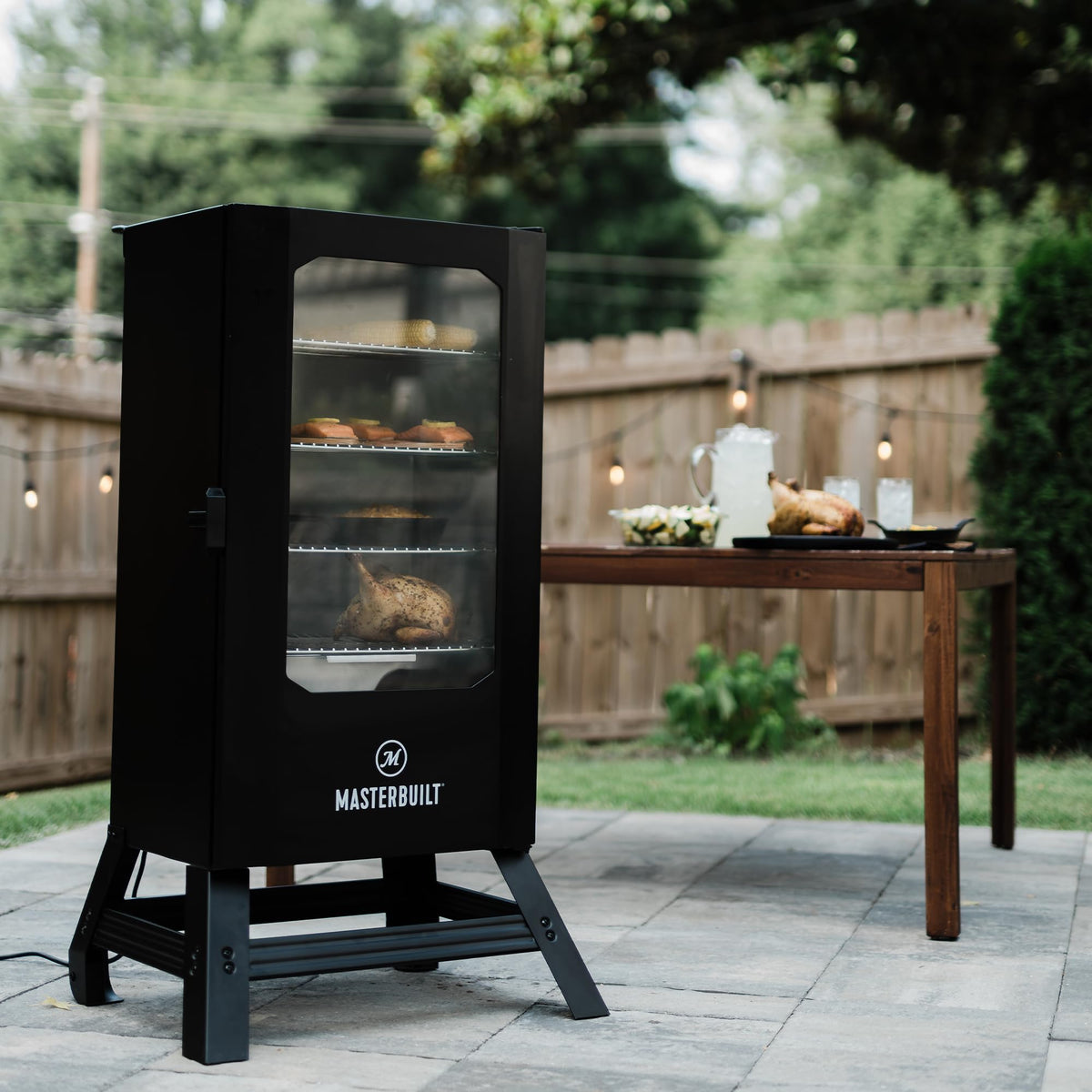 Masterbuilt® 30-inch Digital Electric Vertical BBQ Smoker with Side Wood Chip Loader, Chrome Racks and 710 Cooking Square Inches in Black, Model MB20071117